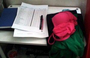 Her clothes, topped with pink panties, on my end table in the morning. 