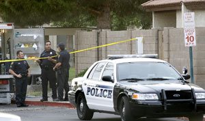 Mesa police searching Trent's house after his arrest at my bar.